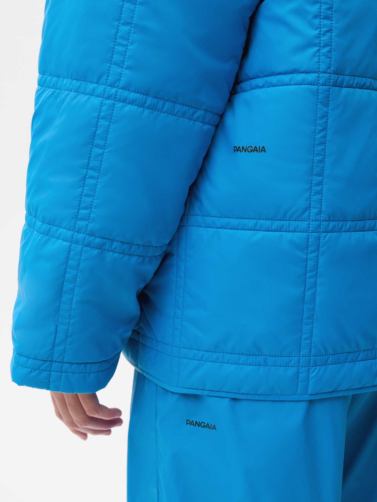 Recycled Nylon FLWRDWN Quilted Collarless Jacket—cerulean blue female